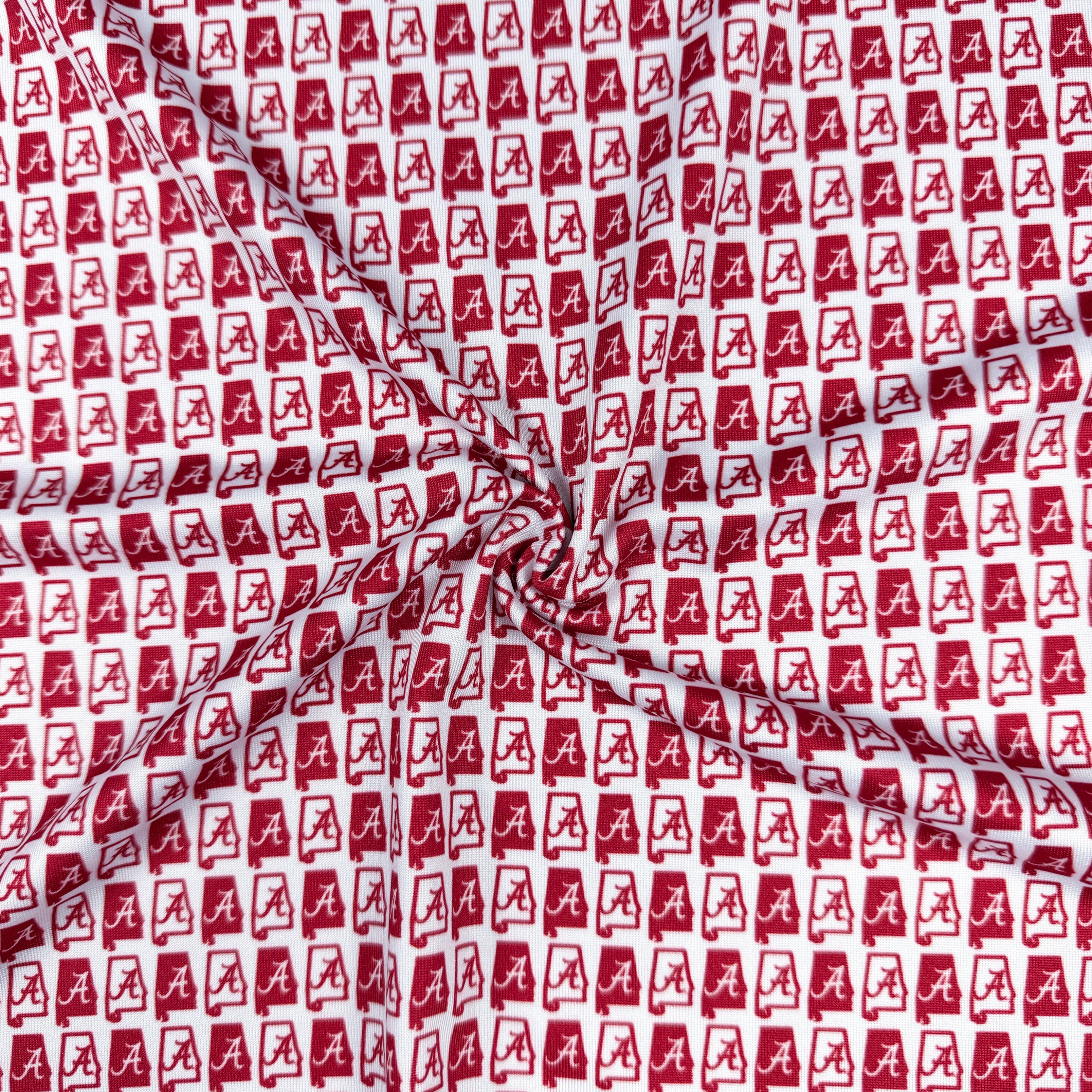Red and white fabric with a pattern of 'A' shapes