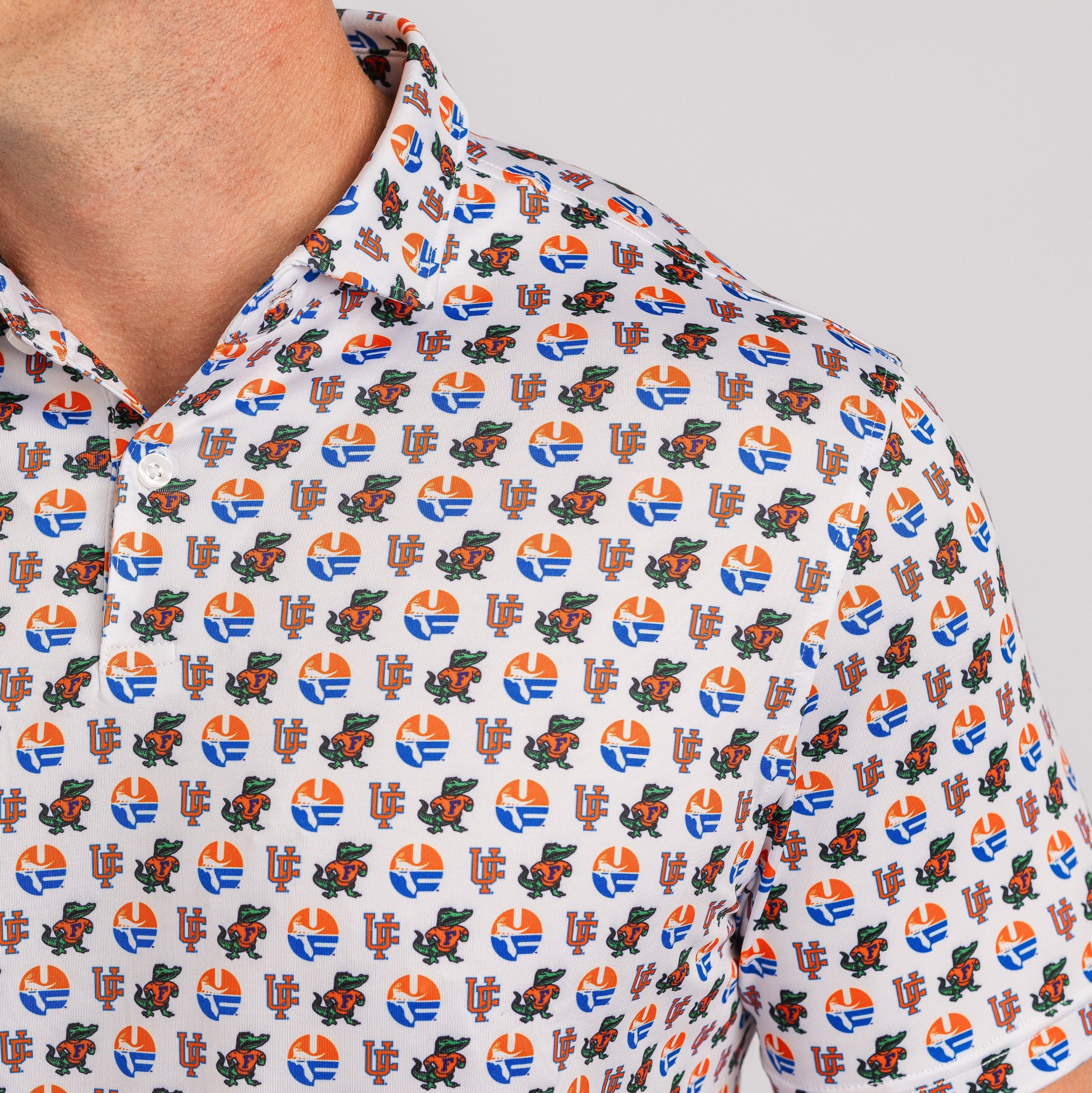 Close-up of a patterned shirt with colorful design on a plain background