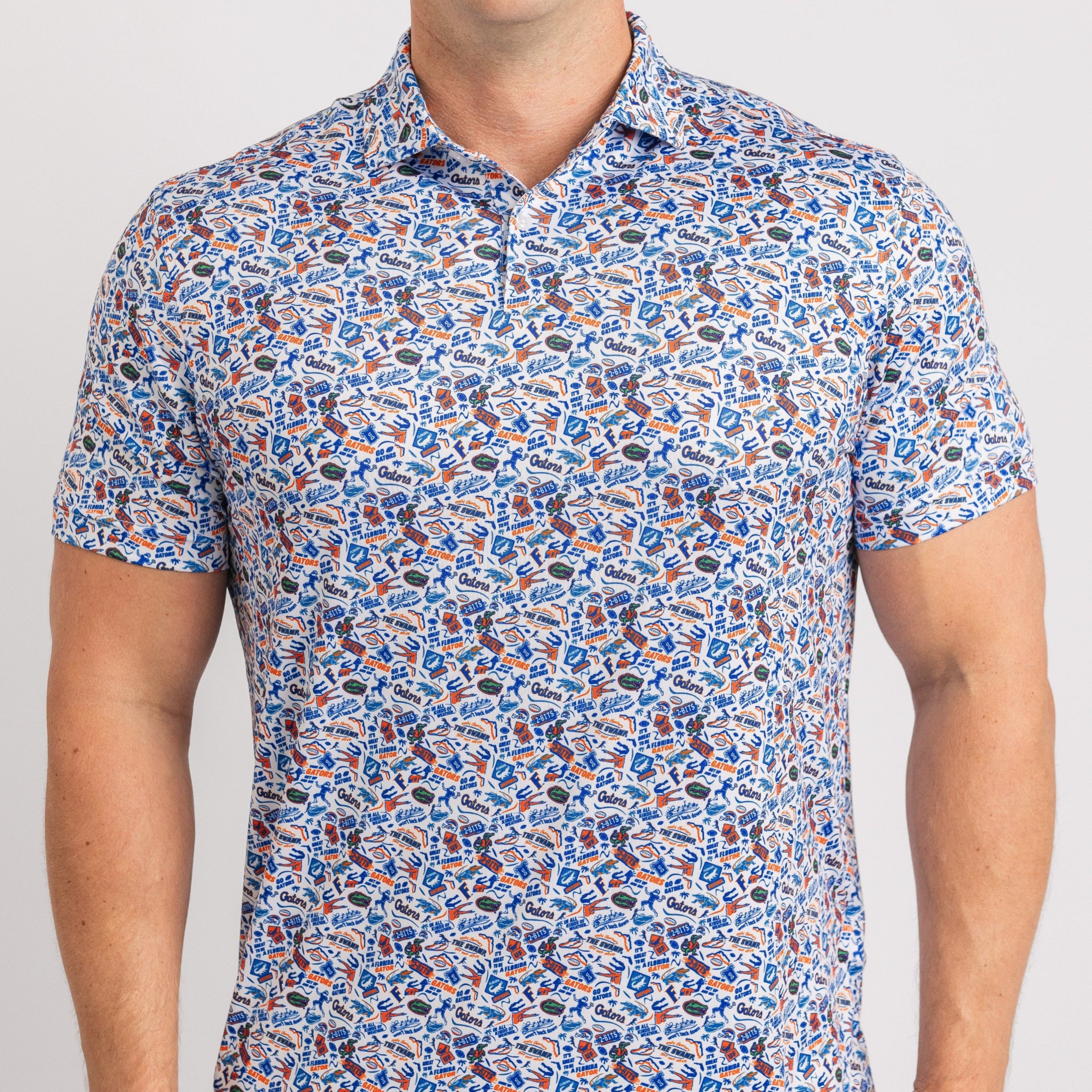 Man wearing a patterned short-sleeve shirt on a plain background