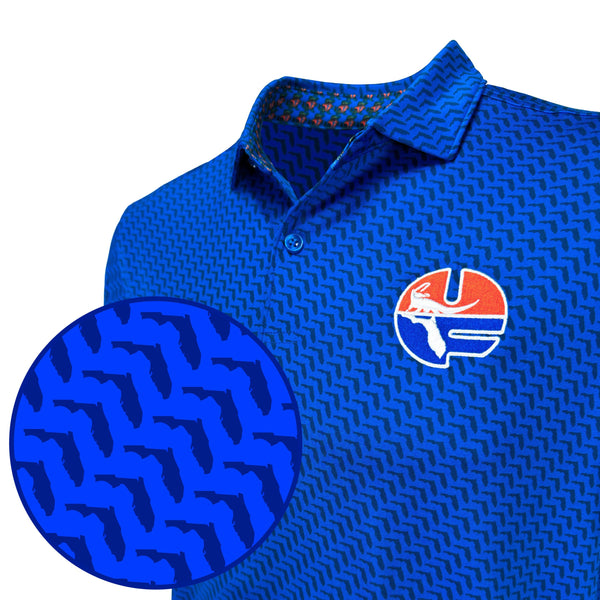 Blue patterned polo shirt with a logo on a white background