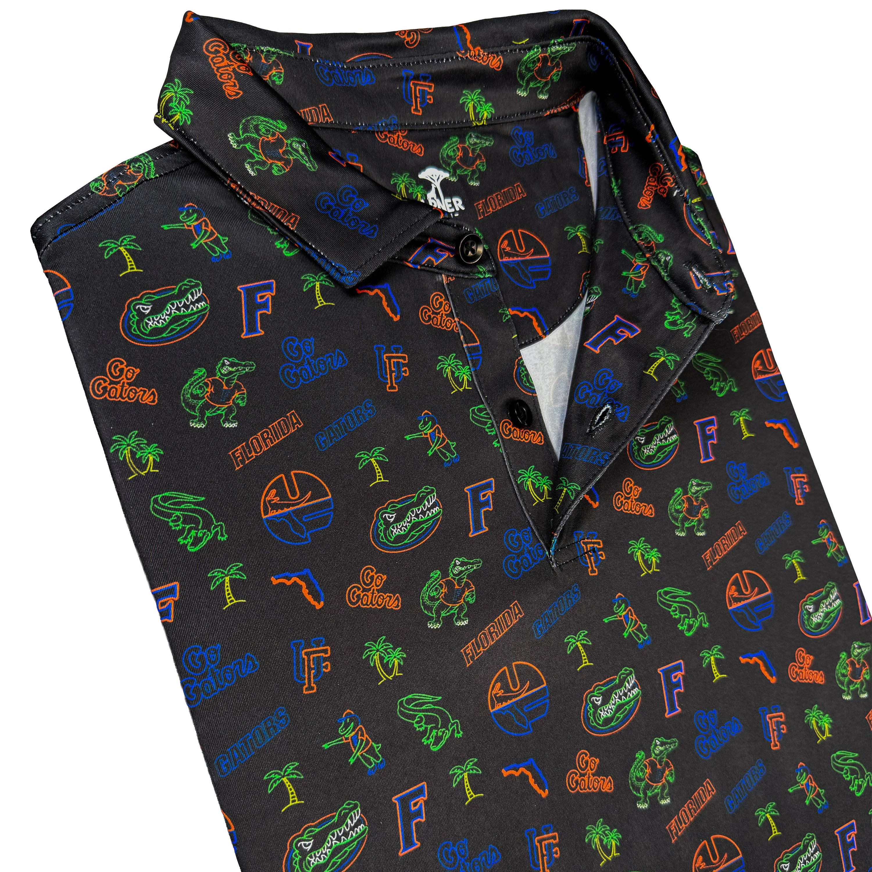 Folded black polo shirt with colorful patterns on a white background