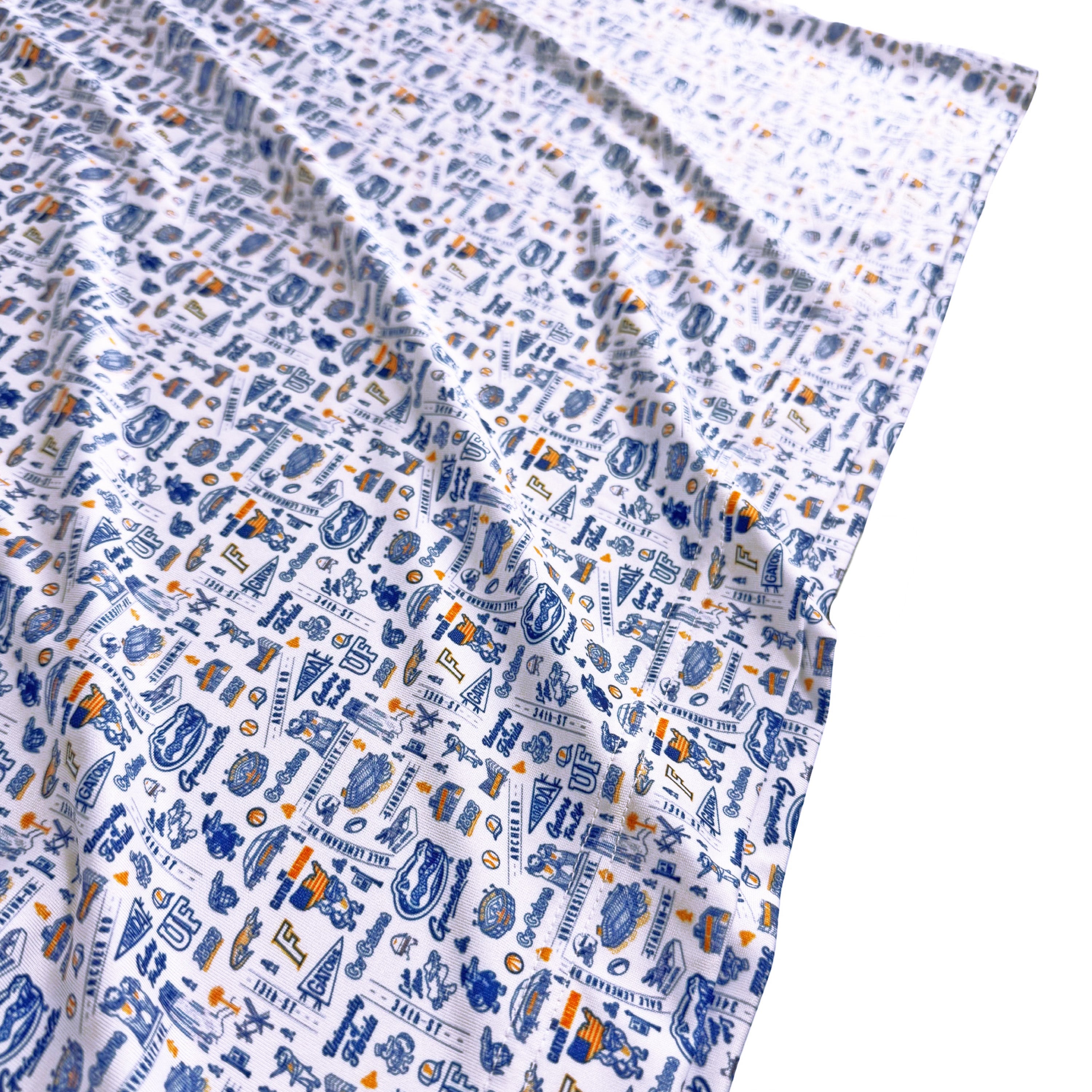 Patterned fabric with blue and orange colors on a white background