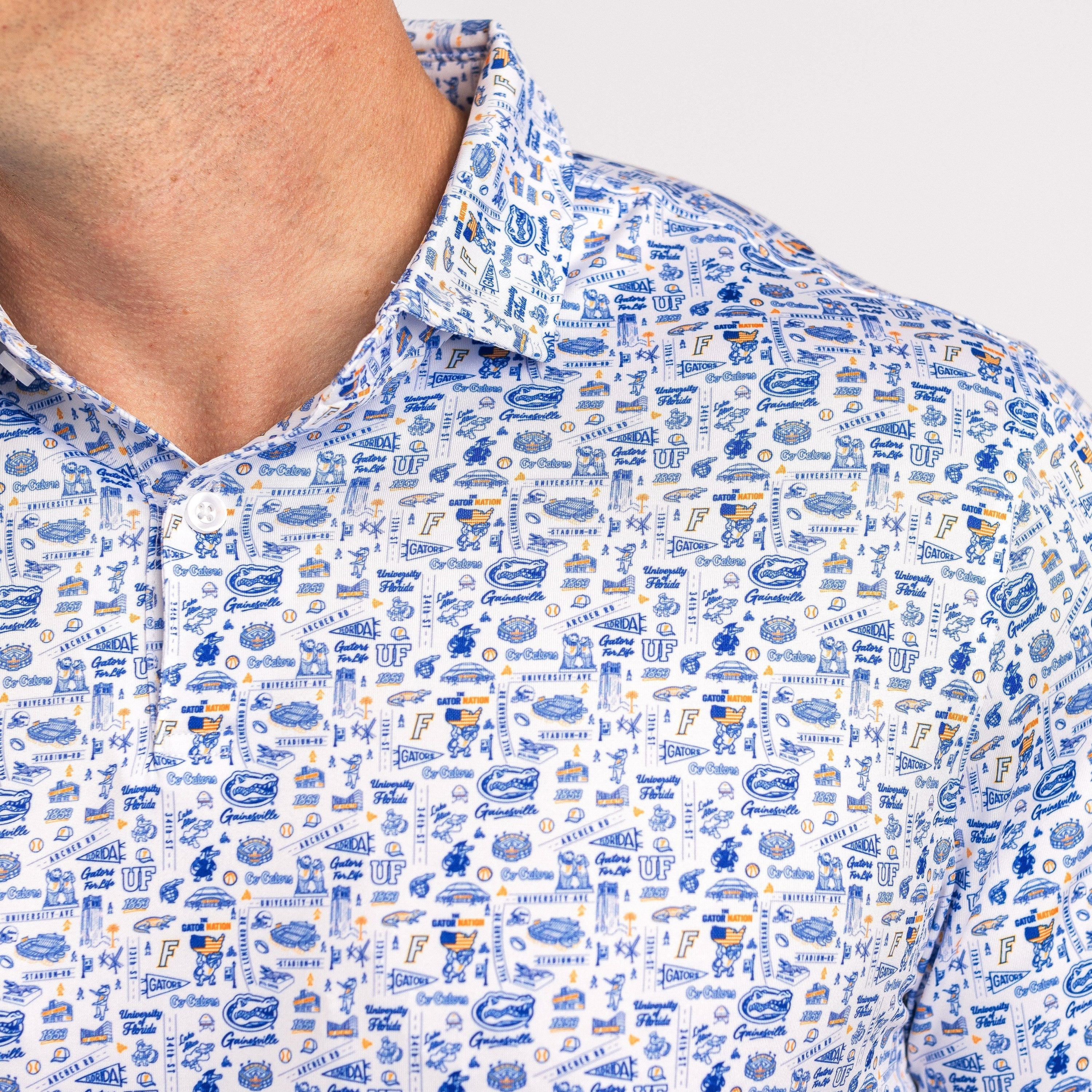 Close-up of a person wearing a patterned shirt with blue and white design.
