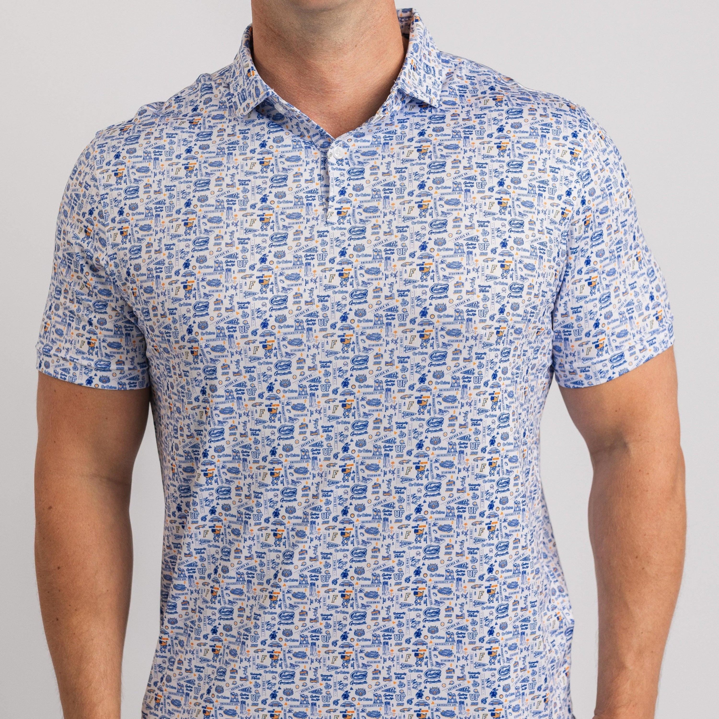 Man wearing a blue and white patterned polo shirt on a gray background