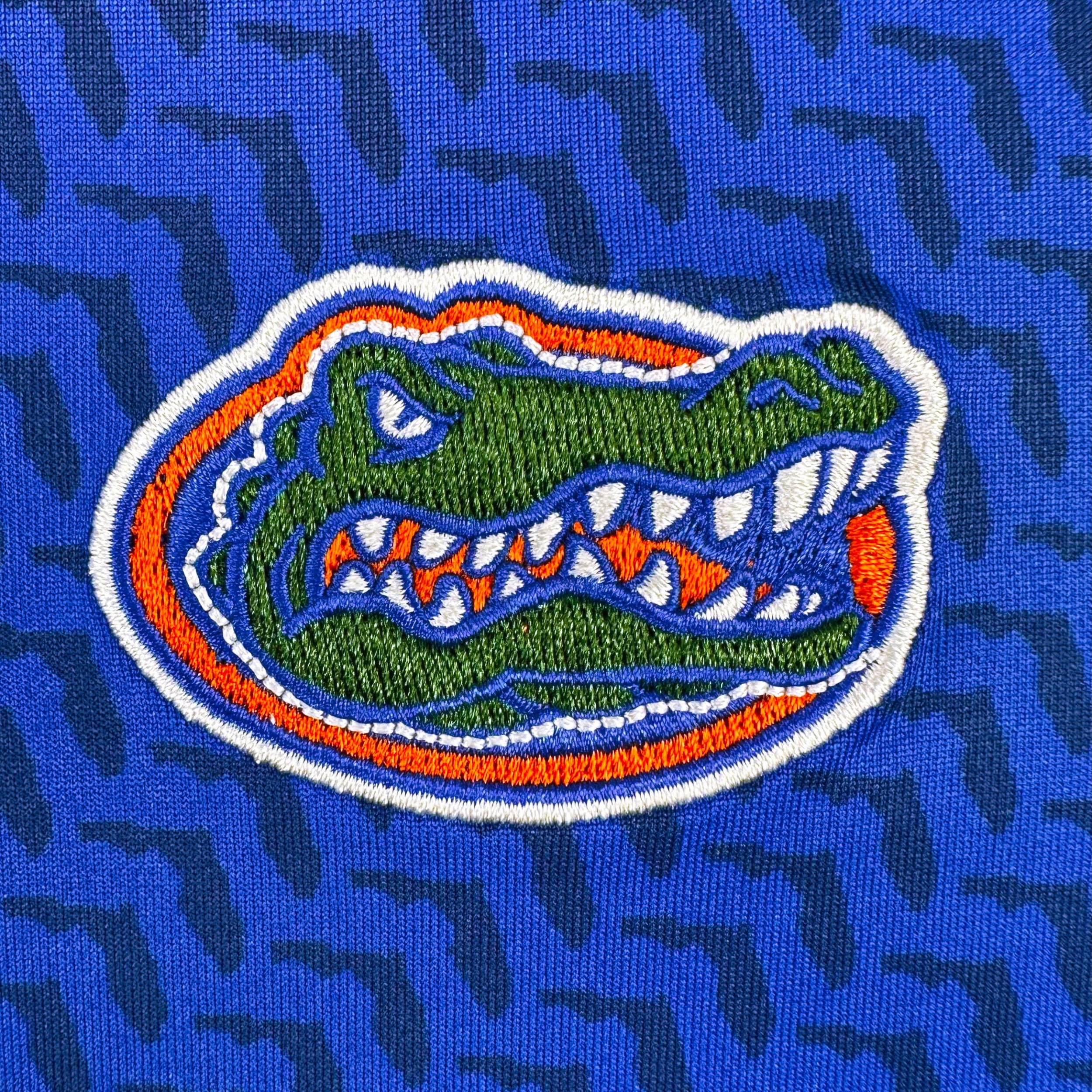 Florida Gators logo on a blue textured background