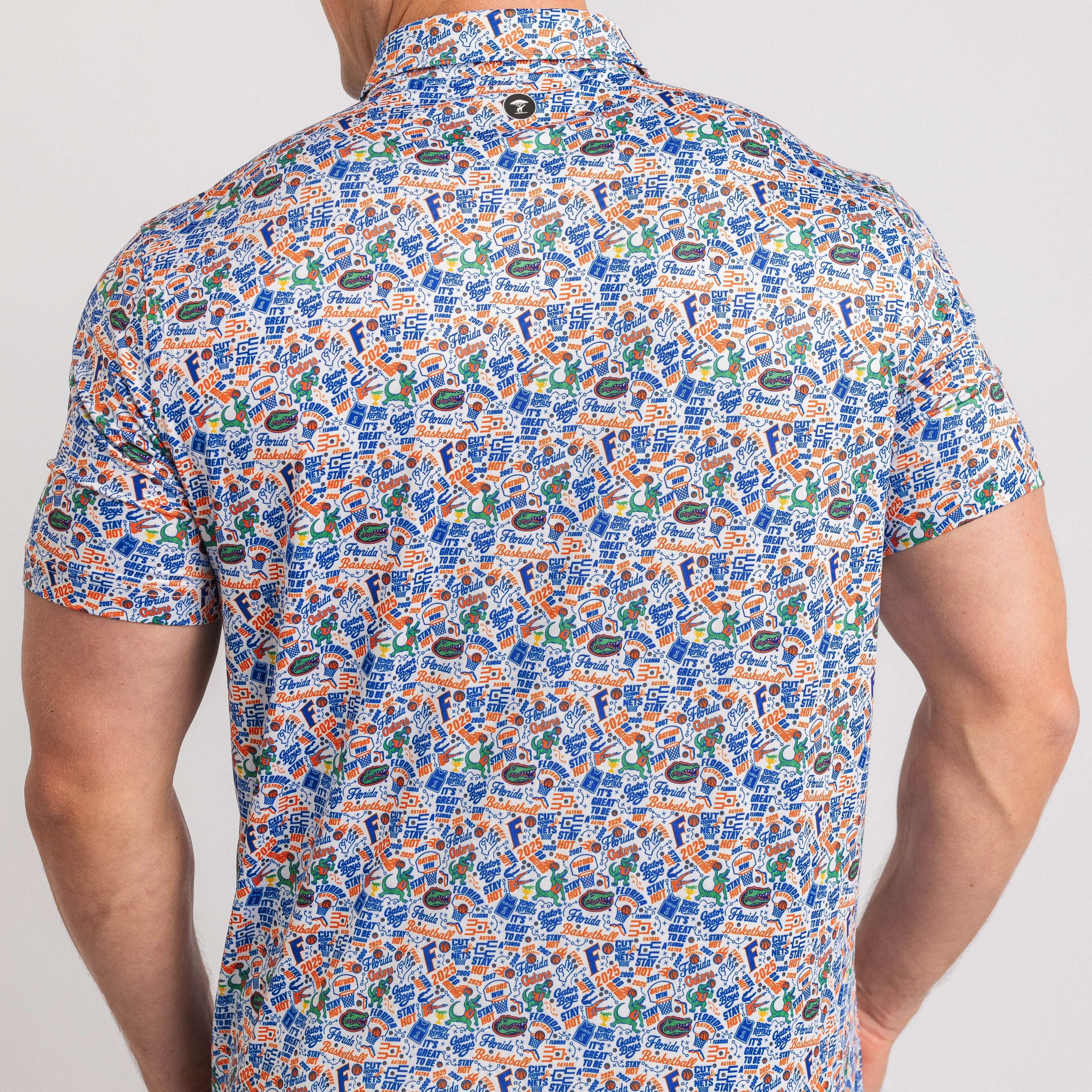 Man wearing a patterned short-sleeve shirt on a plain background