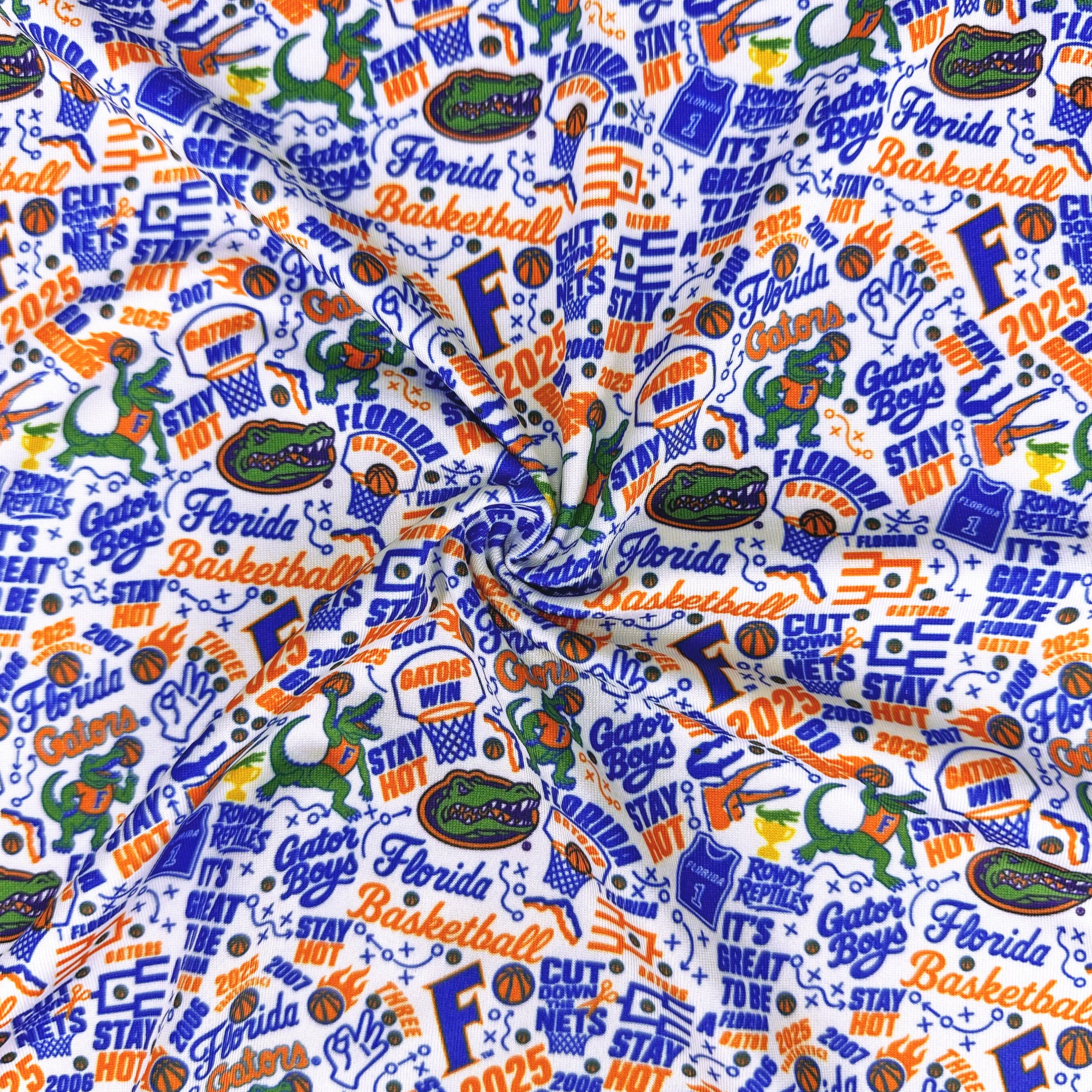 Fabric with Florida Gators sports-themed pattern featuring logos and text.