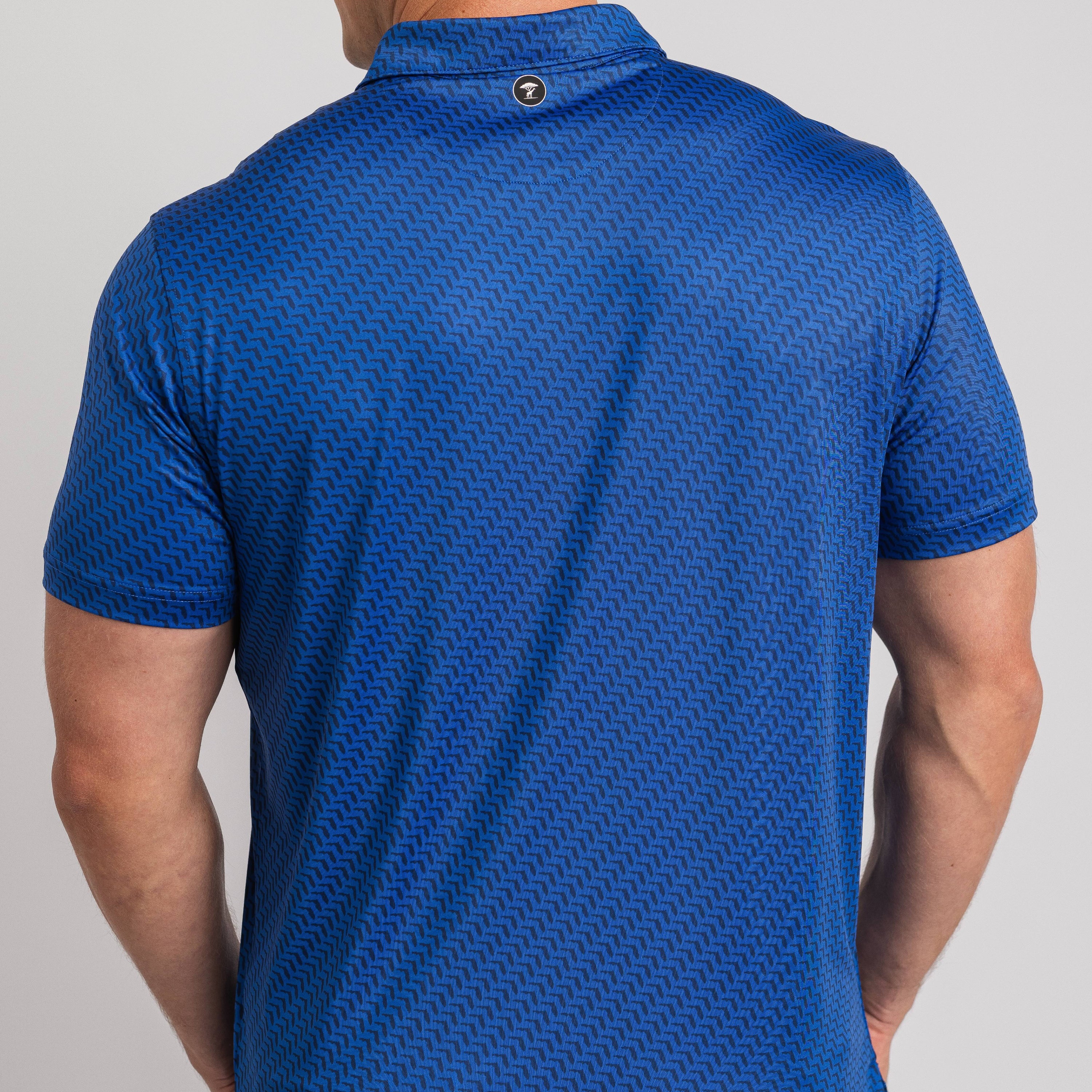 Blue patterned shirt worn by a person on a gray background