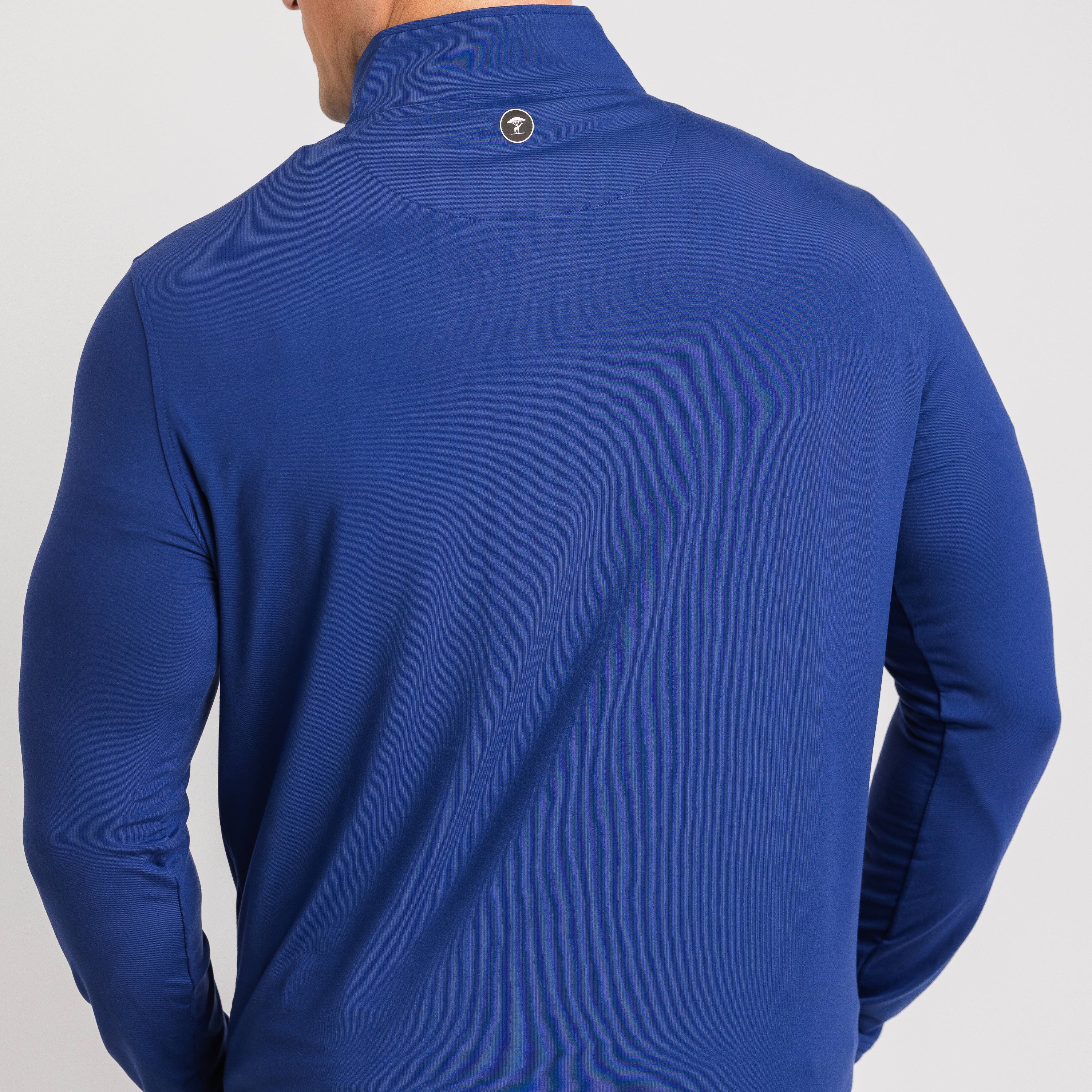 Blue jacket worn by a person on a light gray background
