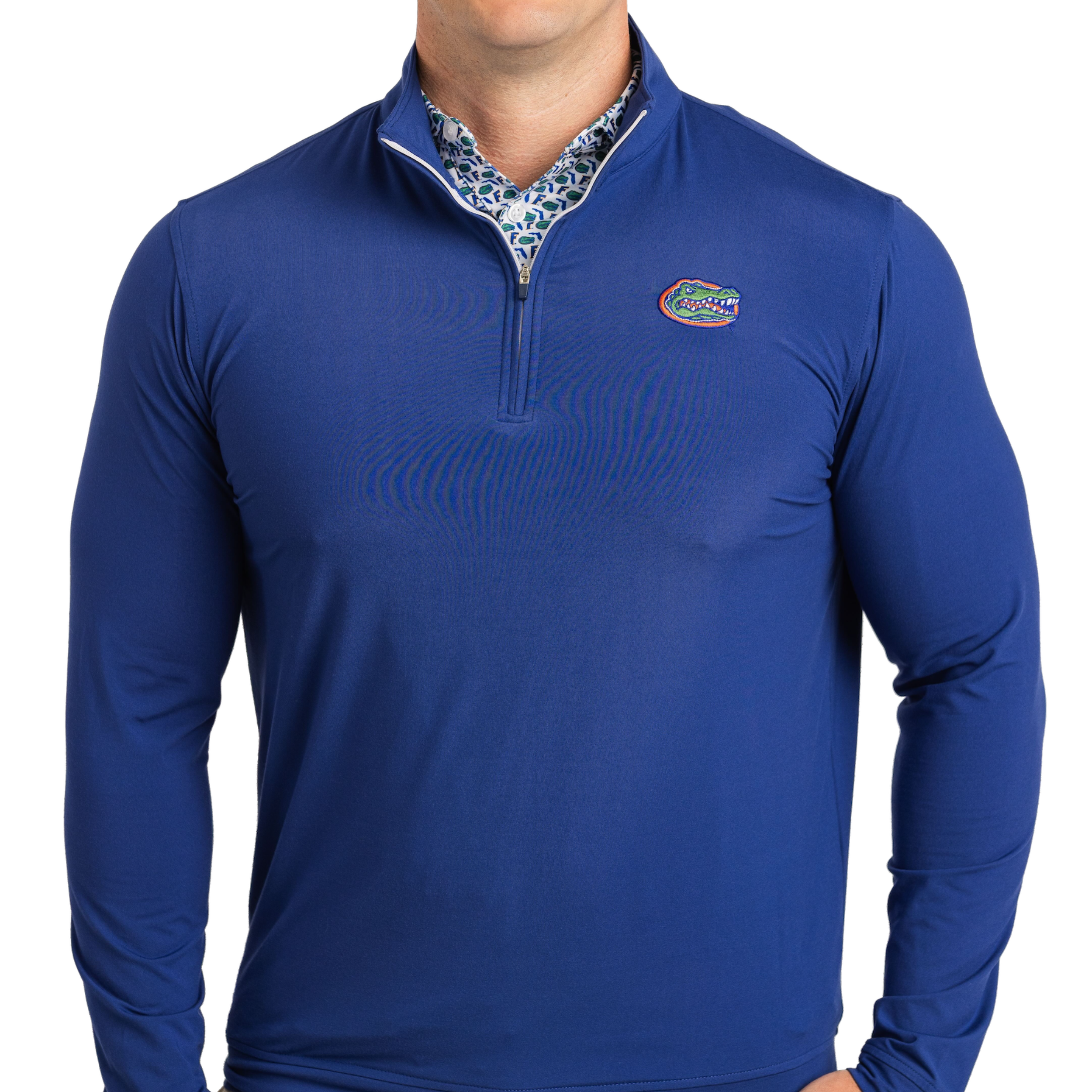 Blue long-sleeve shirt with a logo on a white background