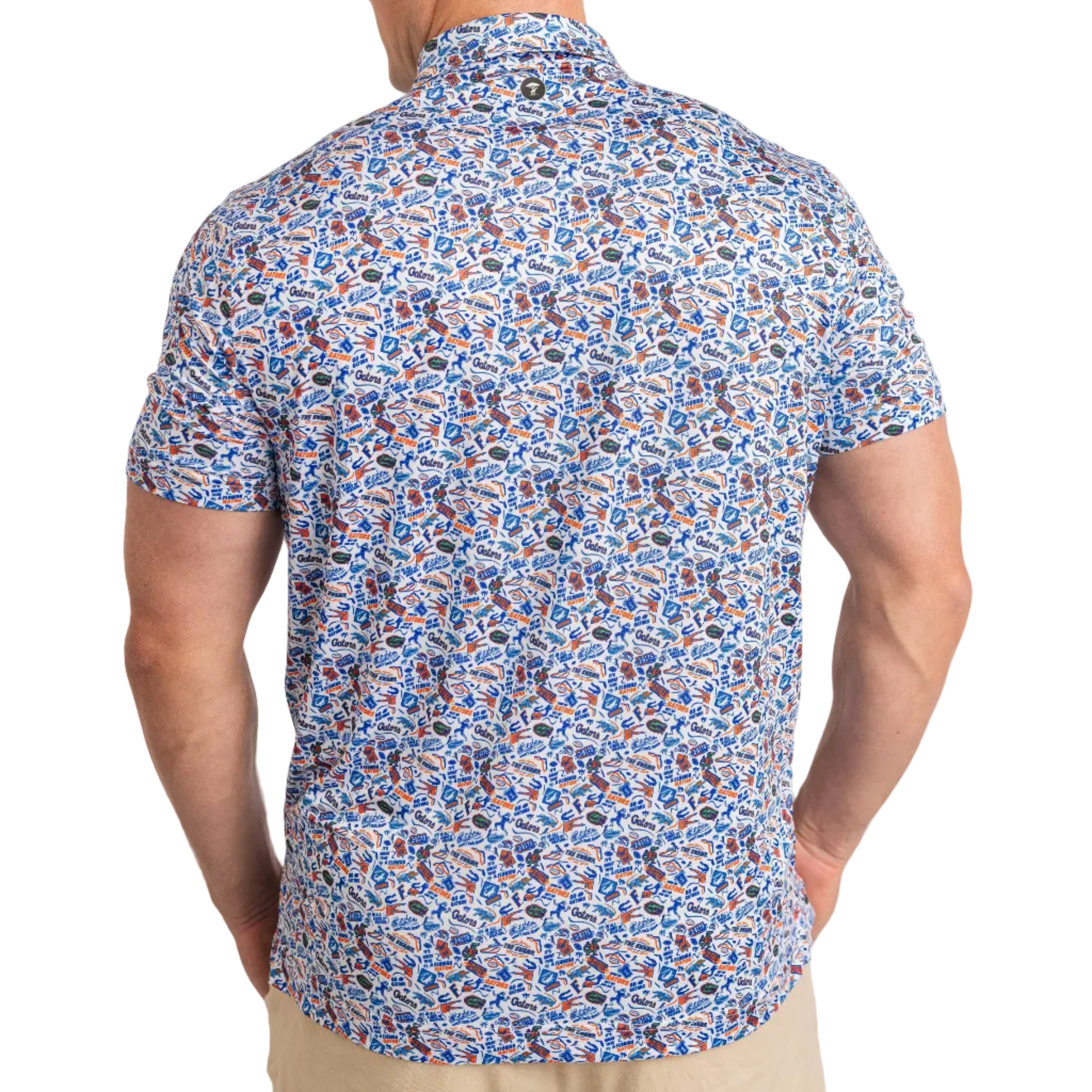 Man wearing a short-sleeve shirt with a colorful pattern on a plain background
