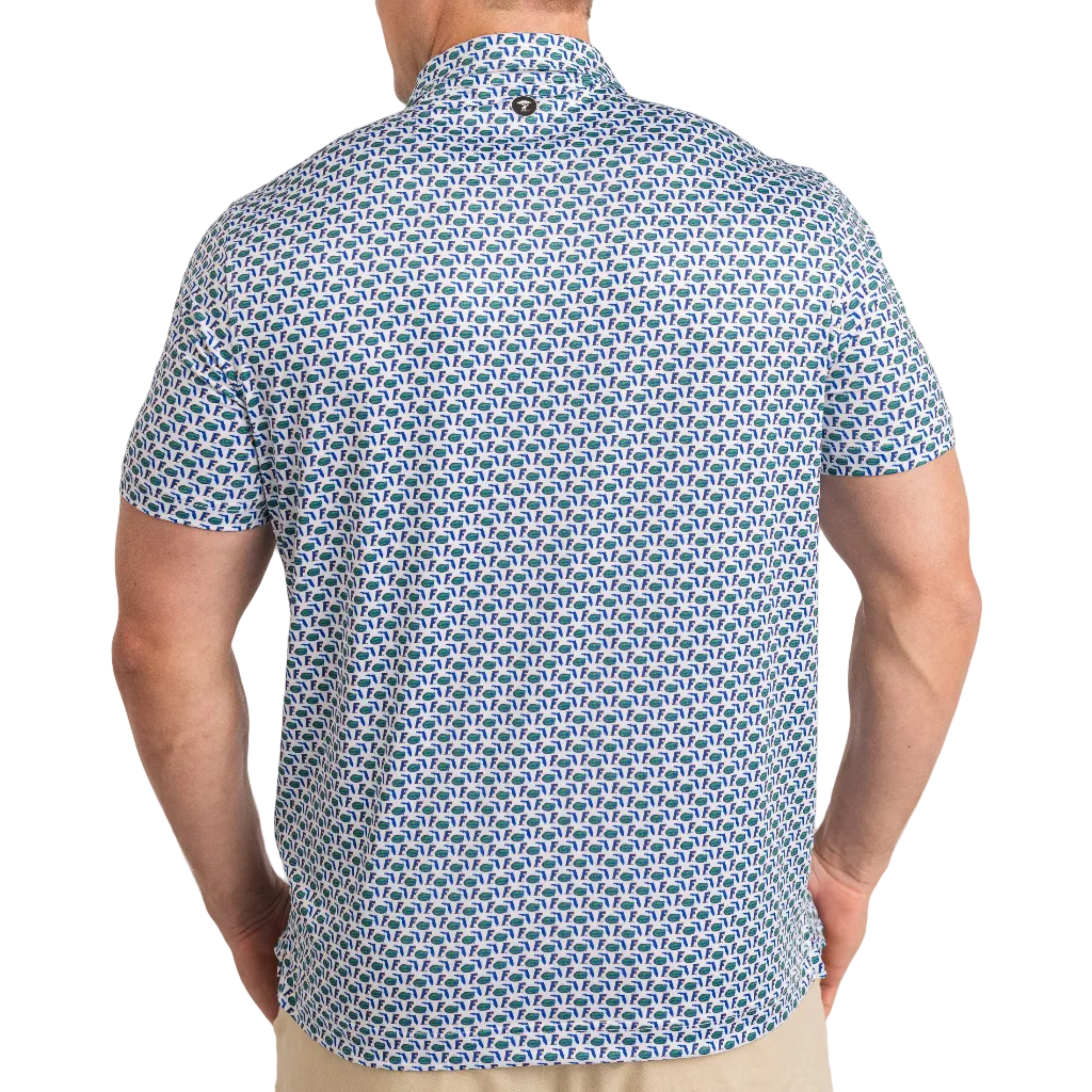 Man wearing a blue patterned shirt on a plain background