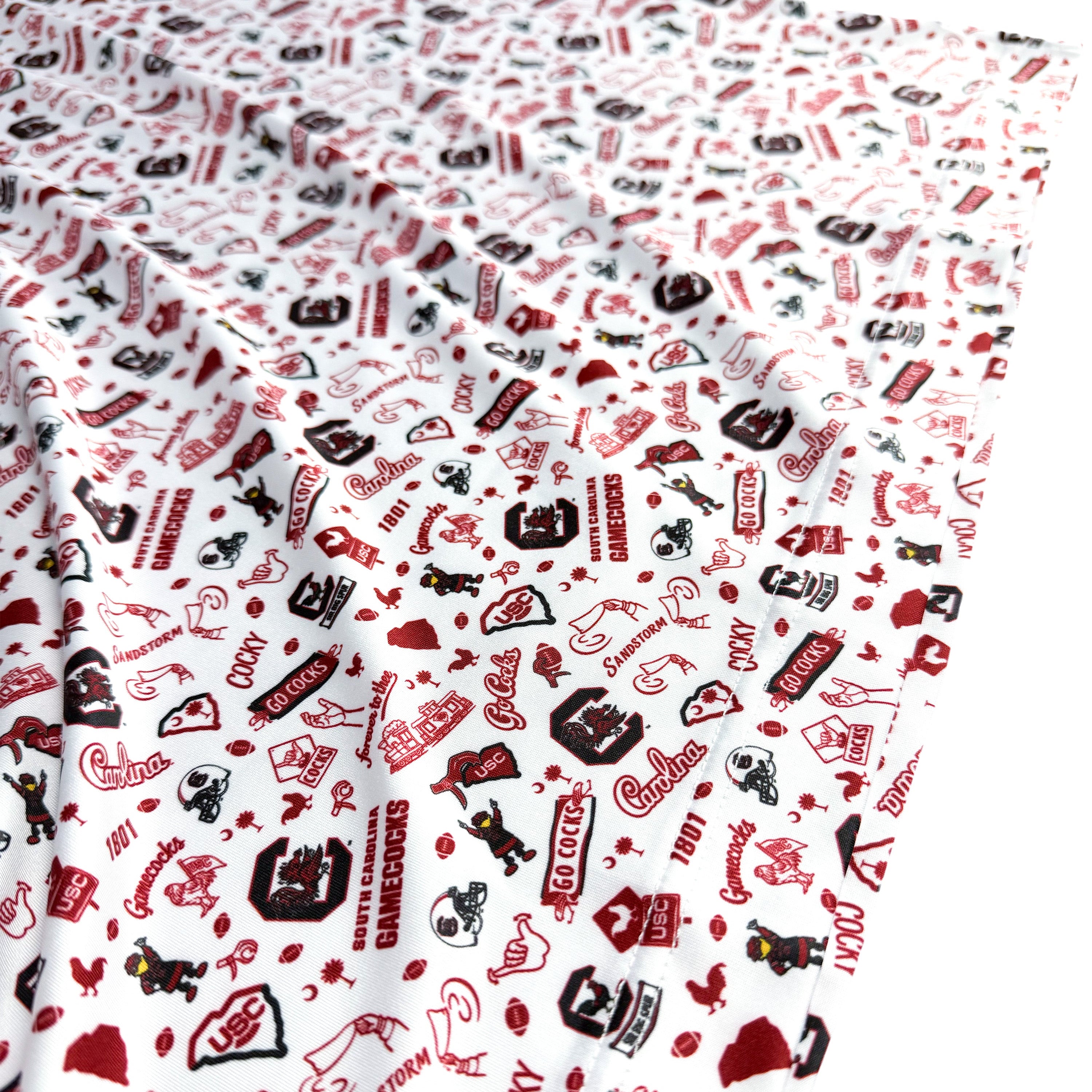 Fabric with red, black, and white pattern on a white background