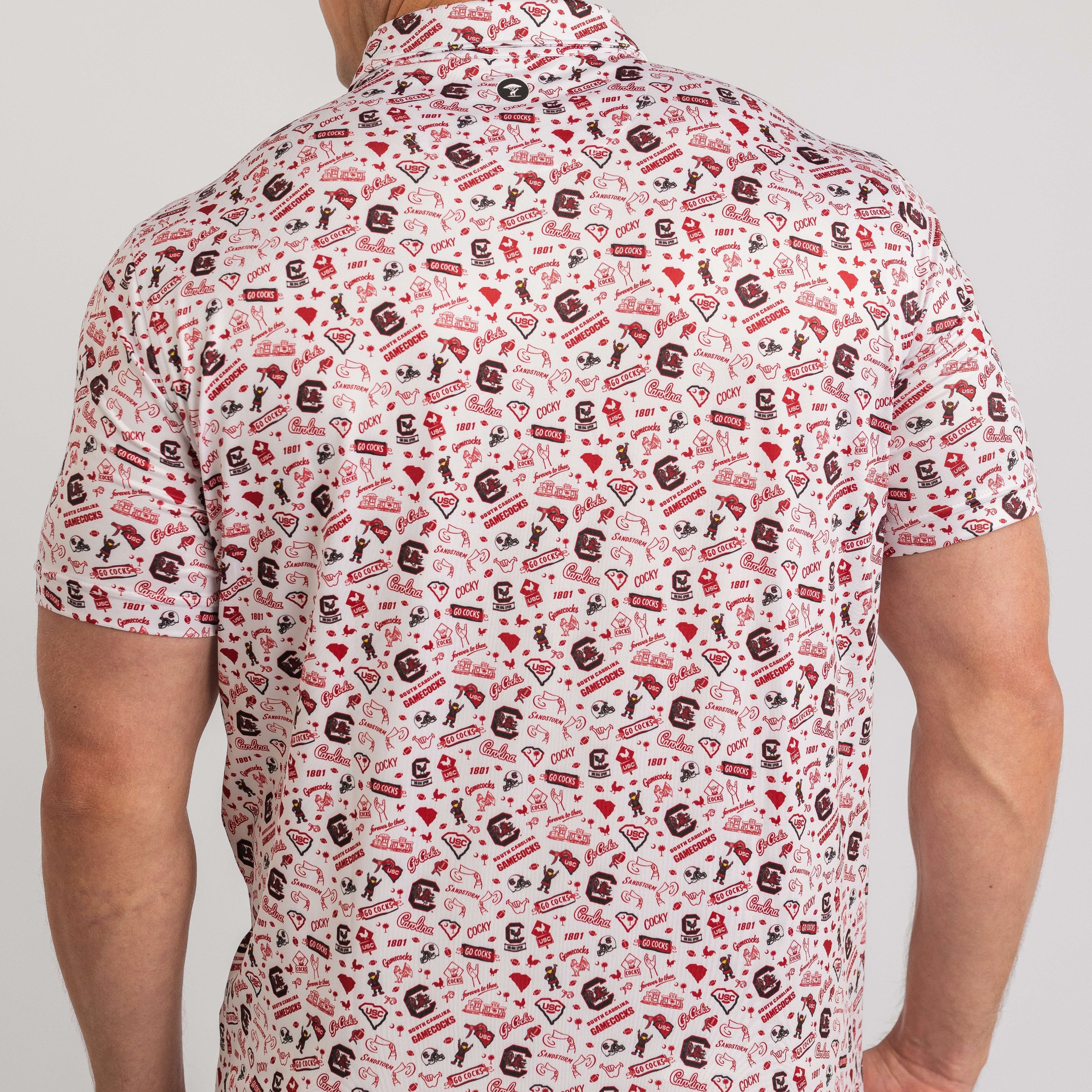 Man wearing a patterned shirt with a neutral background