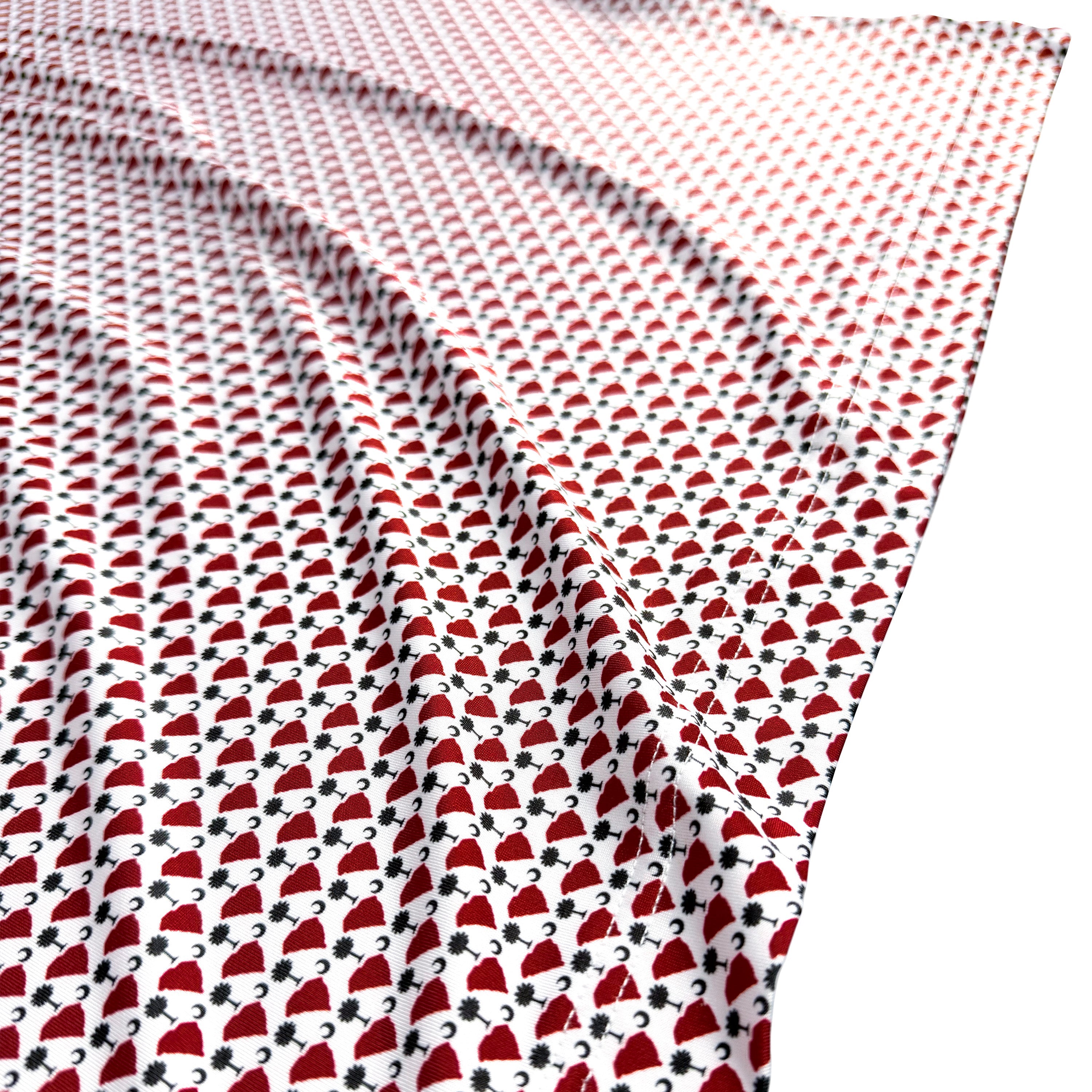 Patterned fabric with red and black design on a white background