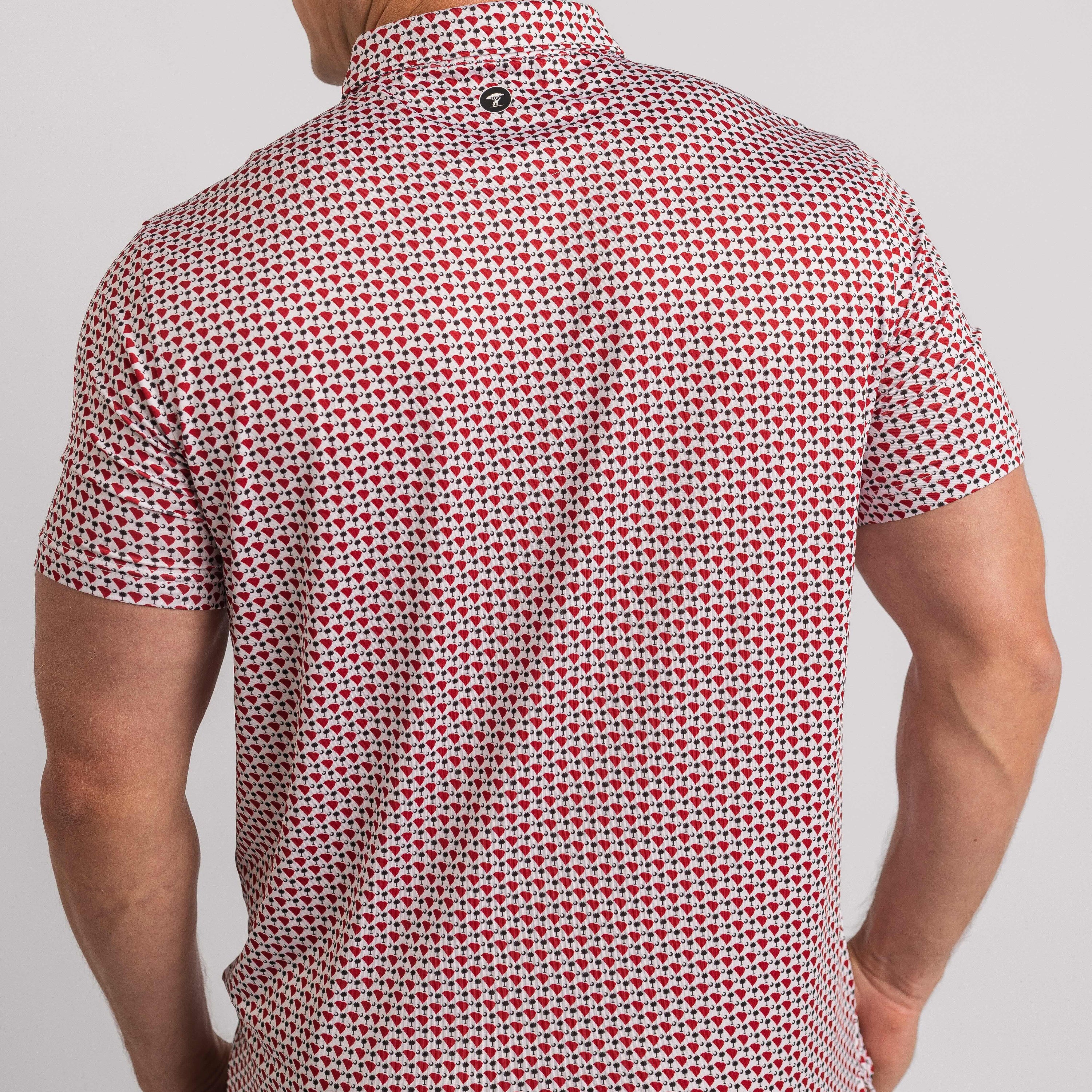 Man wearing a red and white patterned shirt on a light gray background