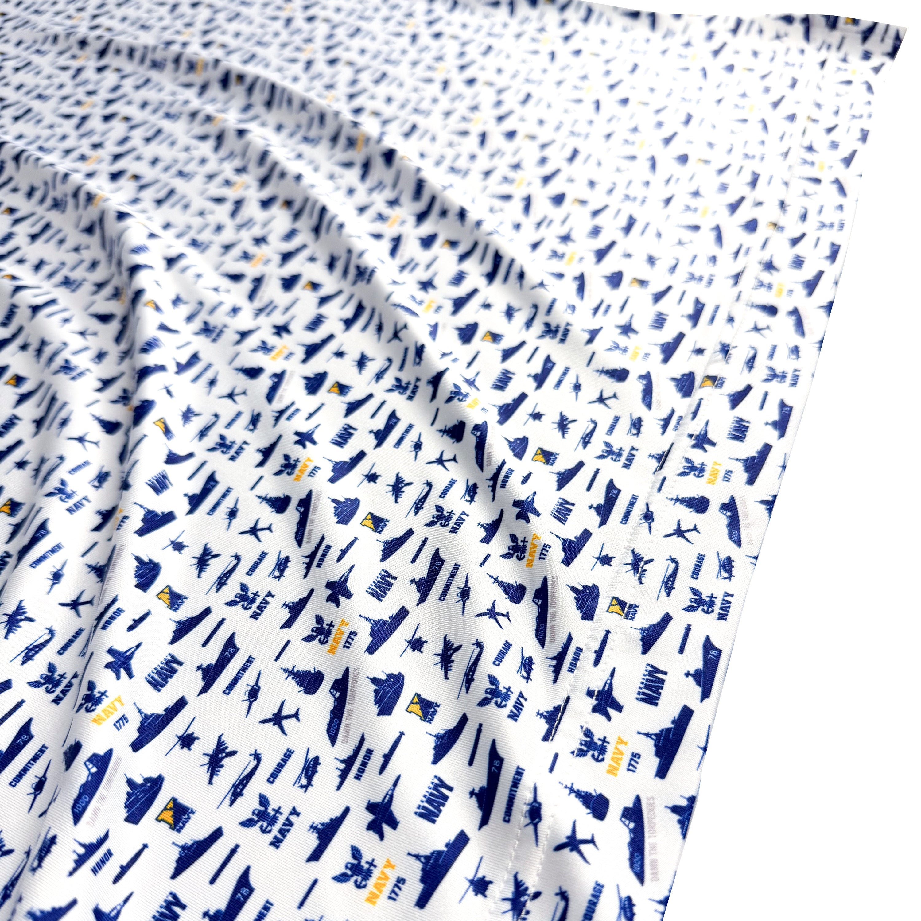 White fabric with blue airplane pattern