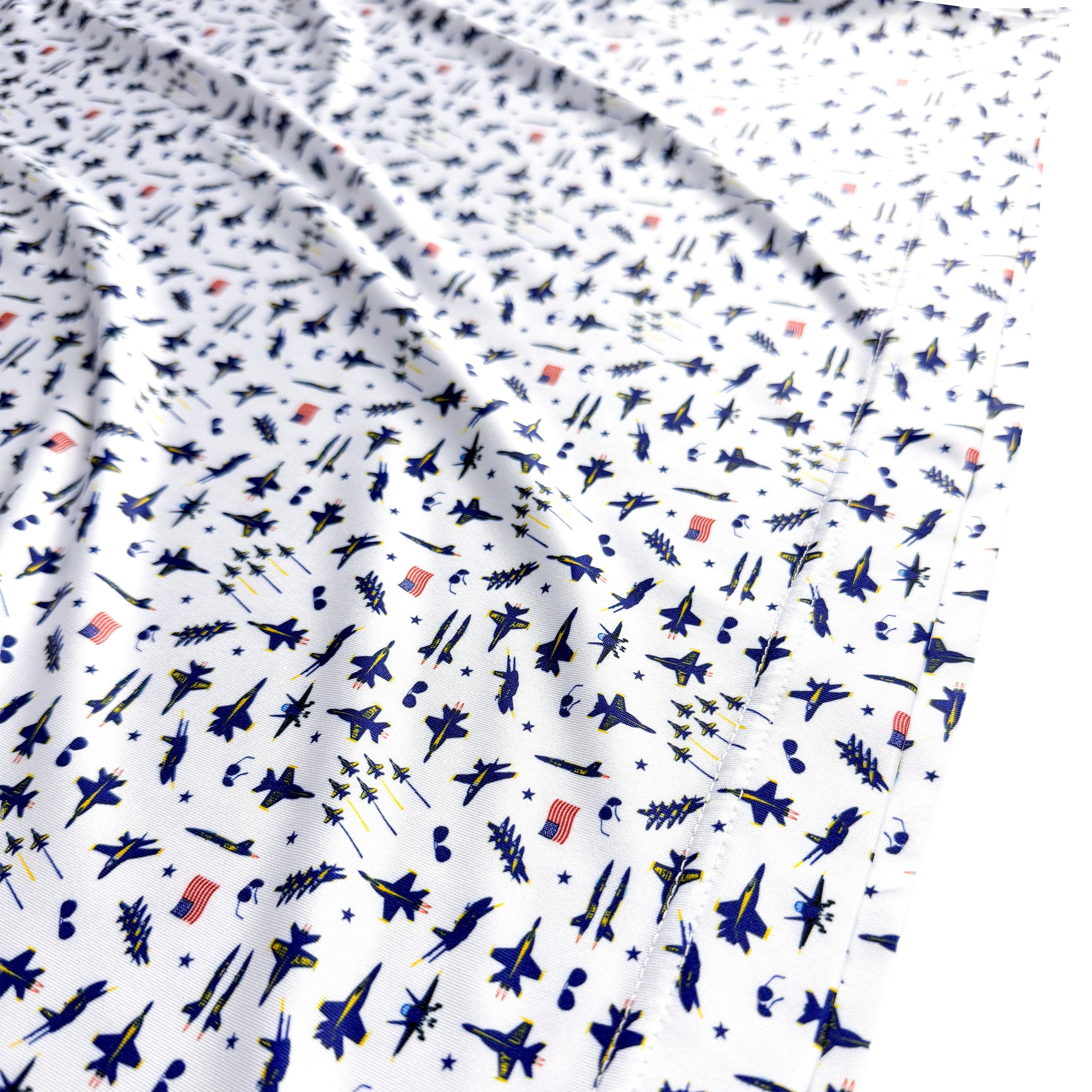 Fabric with small airplane pattern on a white background