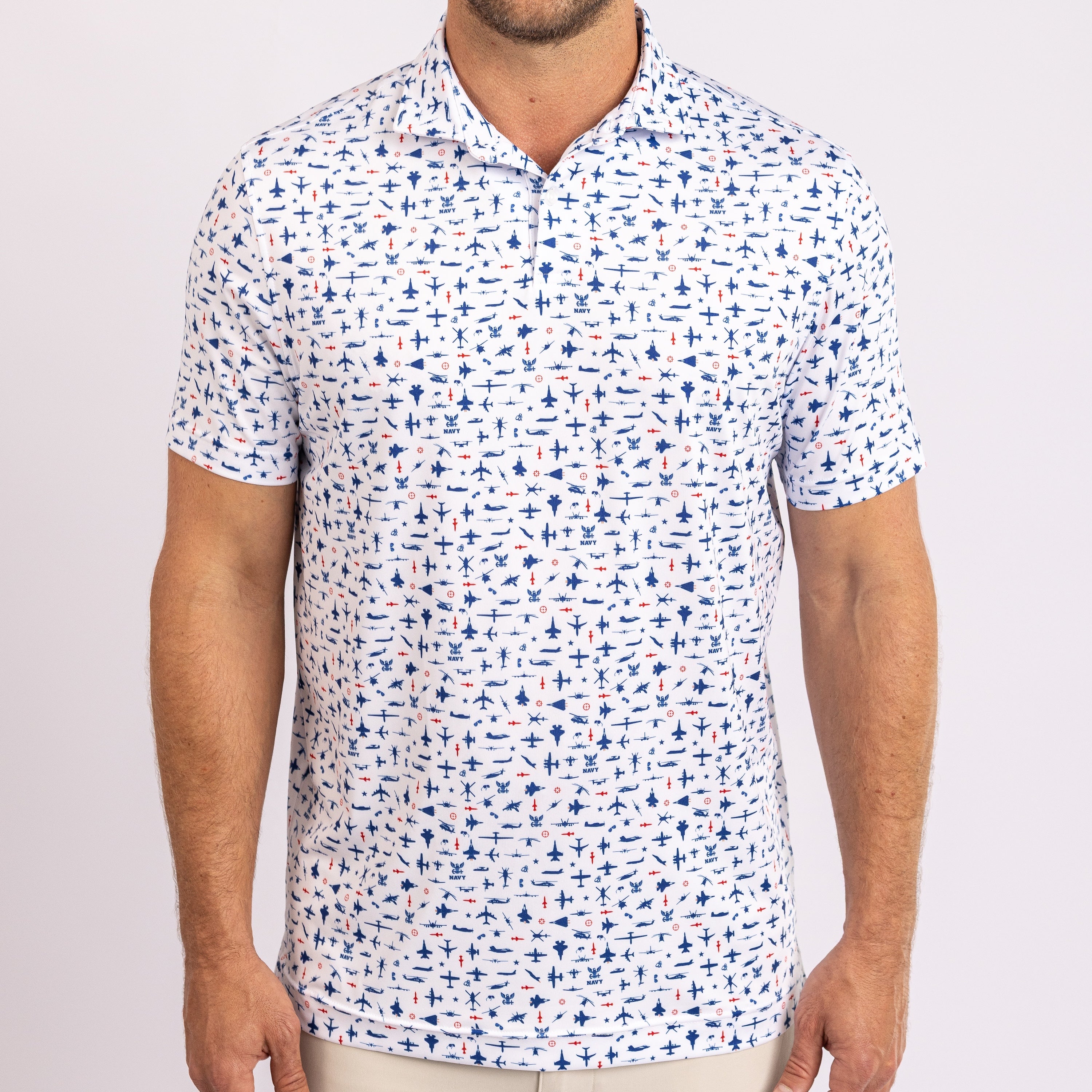 A man wearing a white short-sleeve polo shirt with an all-over blue and orange nautical pattern