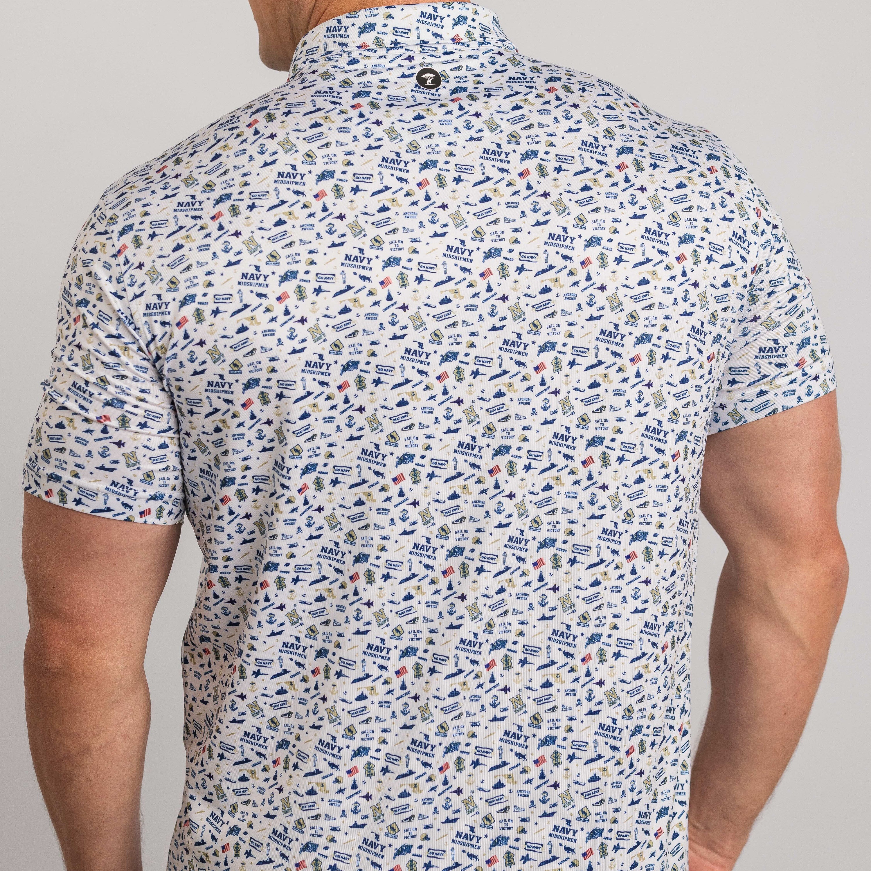 Man wearing a patterned short-sleeve shirt against a plain background