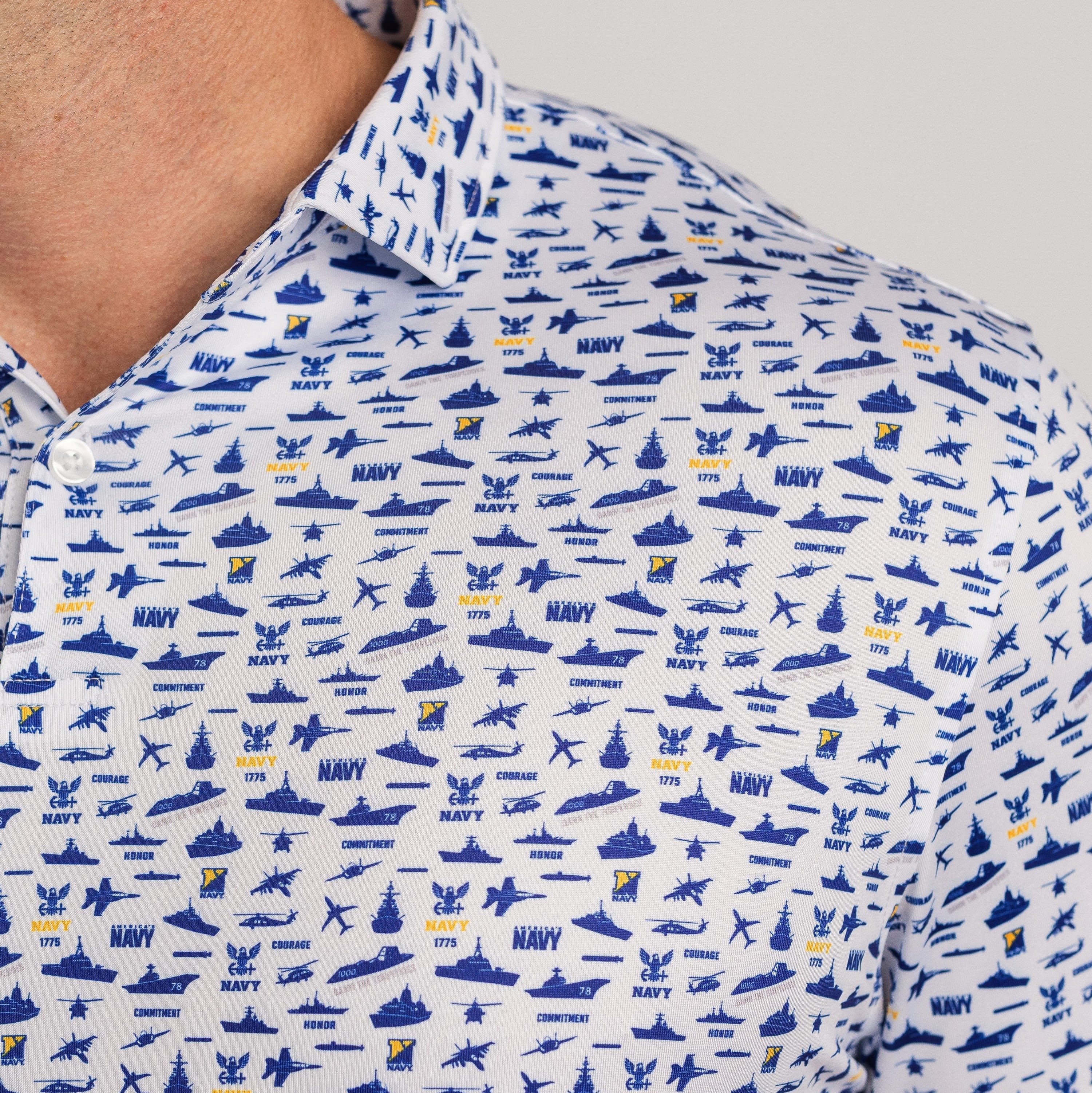Close-up of a shirt with navy-themed pattern on a white background