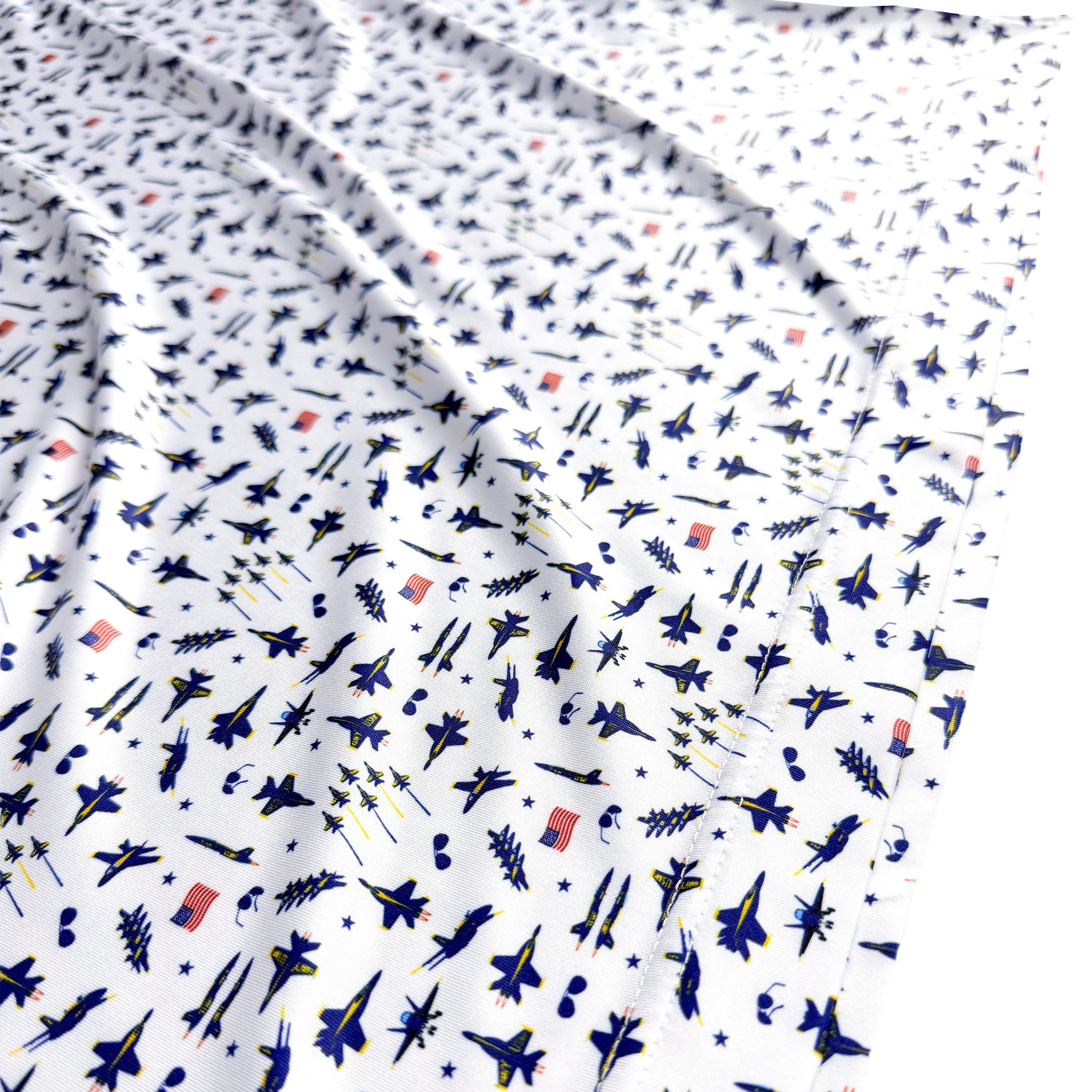 Fabric with small airplane pattern on a white background