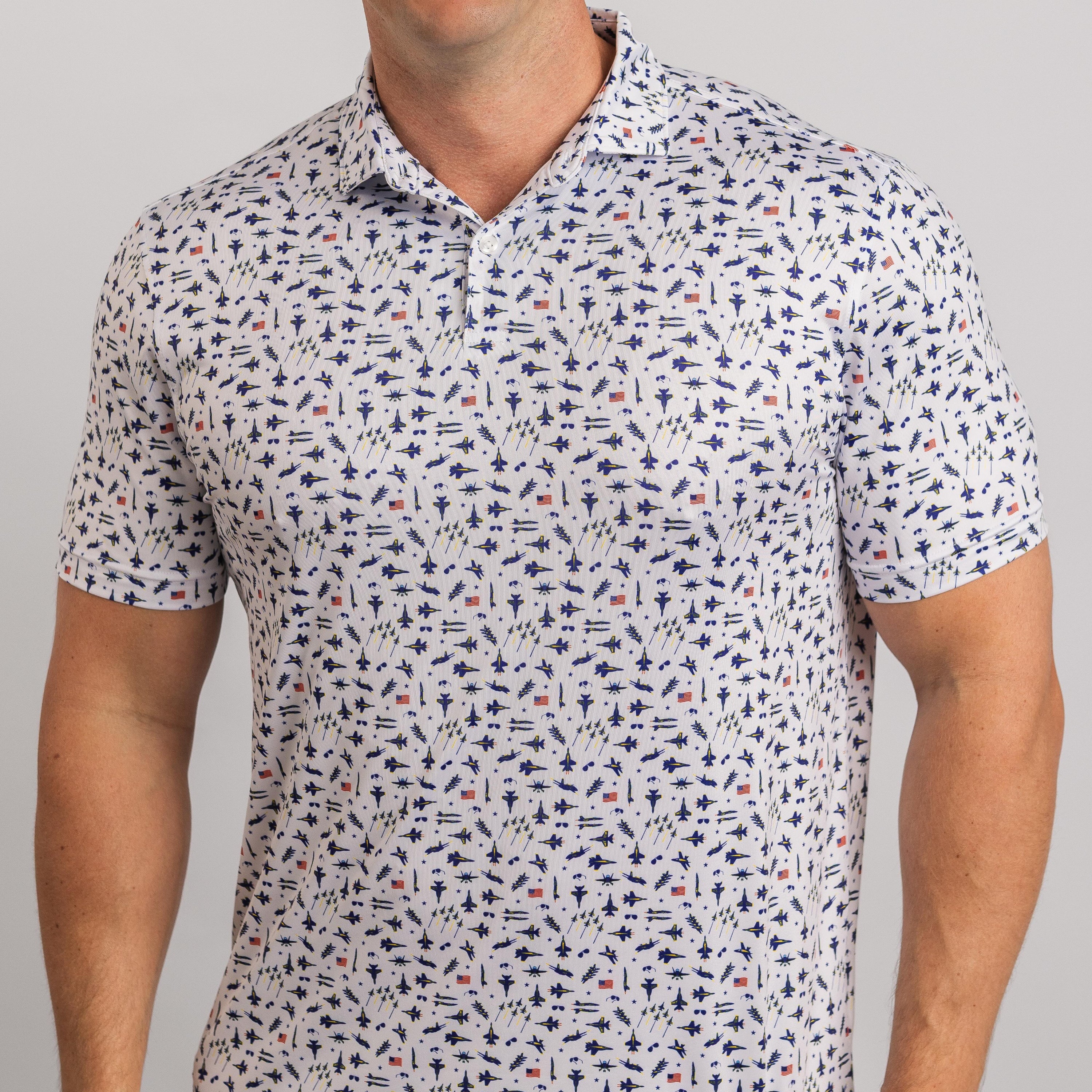 Man wearing a patterned short-sleeve shirt against a plain background