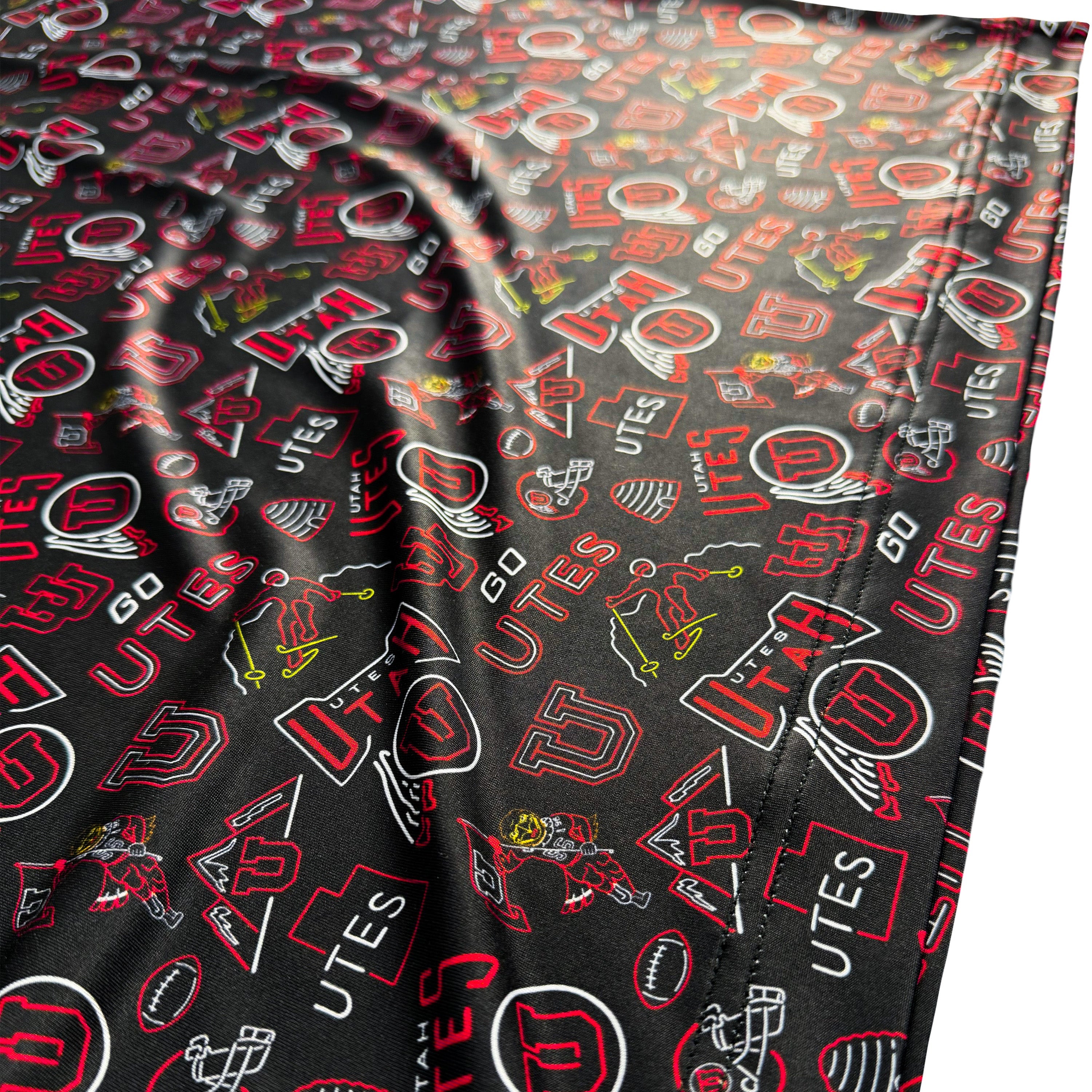 Fitted sheet with Utah Utes sports-themed pattern on a black background