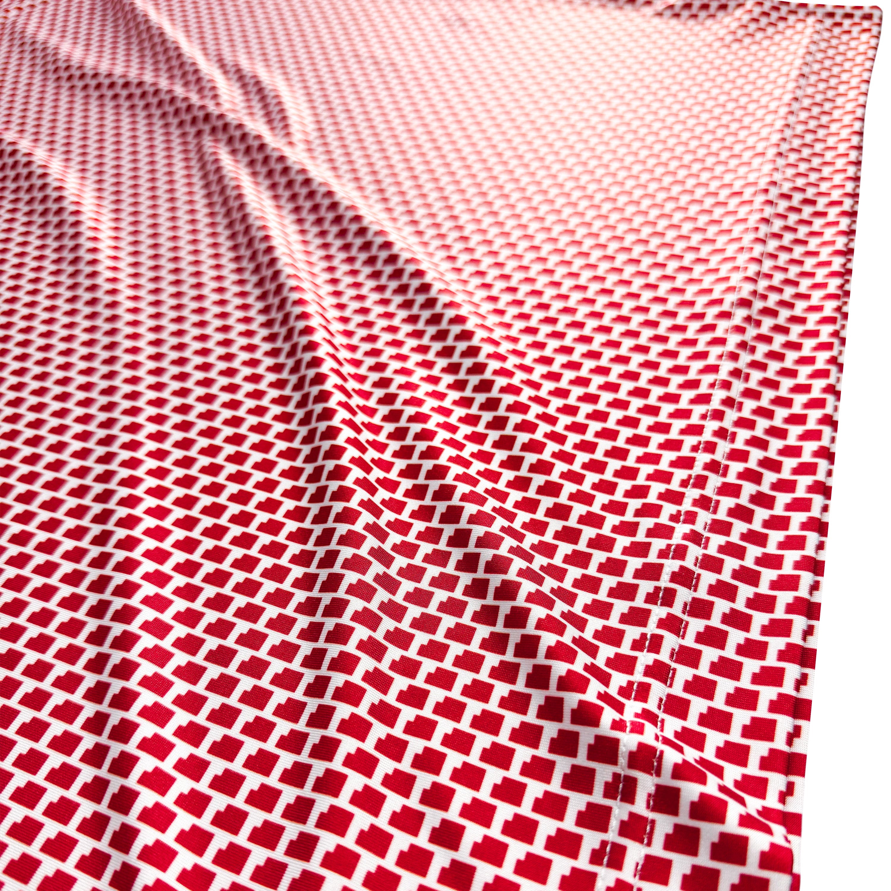 A close-up of a red and white patterned fabric.