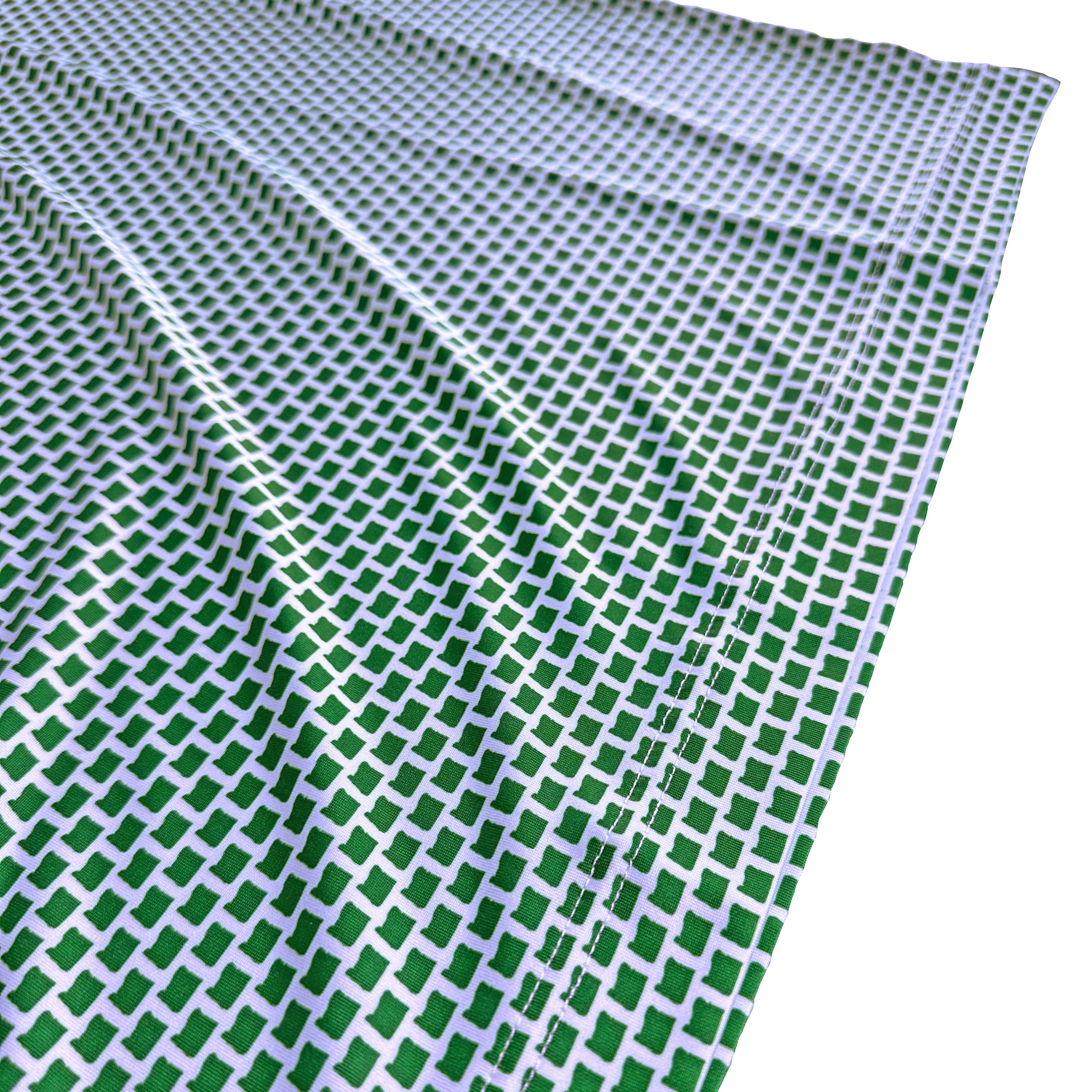 Green and white checkered fabric on a white background